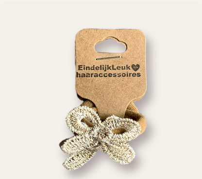 Haar elastiekje met goud strikje